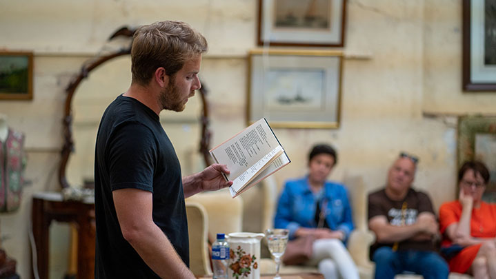 Author giving a talk at a venue